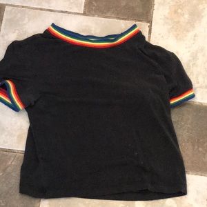 A black top with rainbow assets and a turtleneck